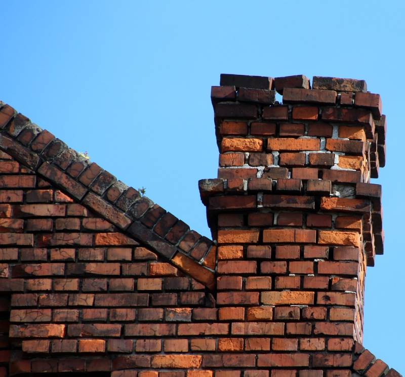 Signs Your Downey Home Needs a Chimney Inspection Damaged chimney on an Downey home showing cracks and missing mortar